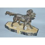 A SPELTER FIGURE OF A DOG, Retriever with game in mouth, on marble effect plinth, height total