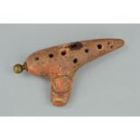 AN OCARINA (MUSICAL INSTRUMENT), stamped E.Mezzetti, Paris, length 12cm