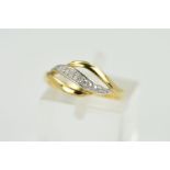 A 9CT GOLD DIAMOND RING, designed with a central slightly tapered curved white gold band set with