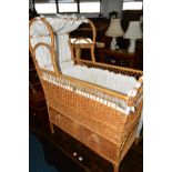 AN EARLY 20TH CENTURY WICKER COT, with two drawers