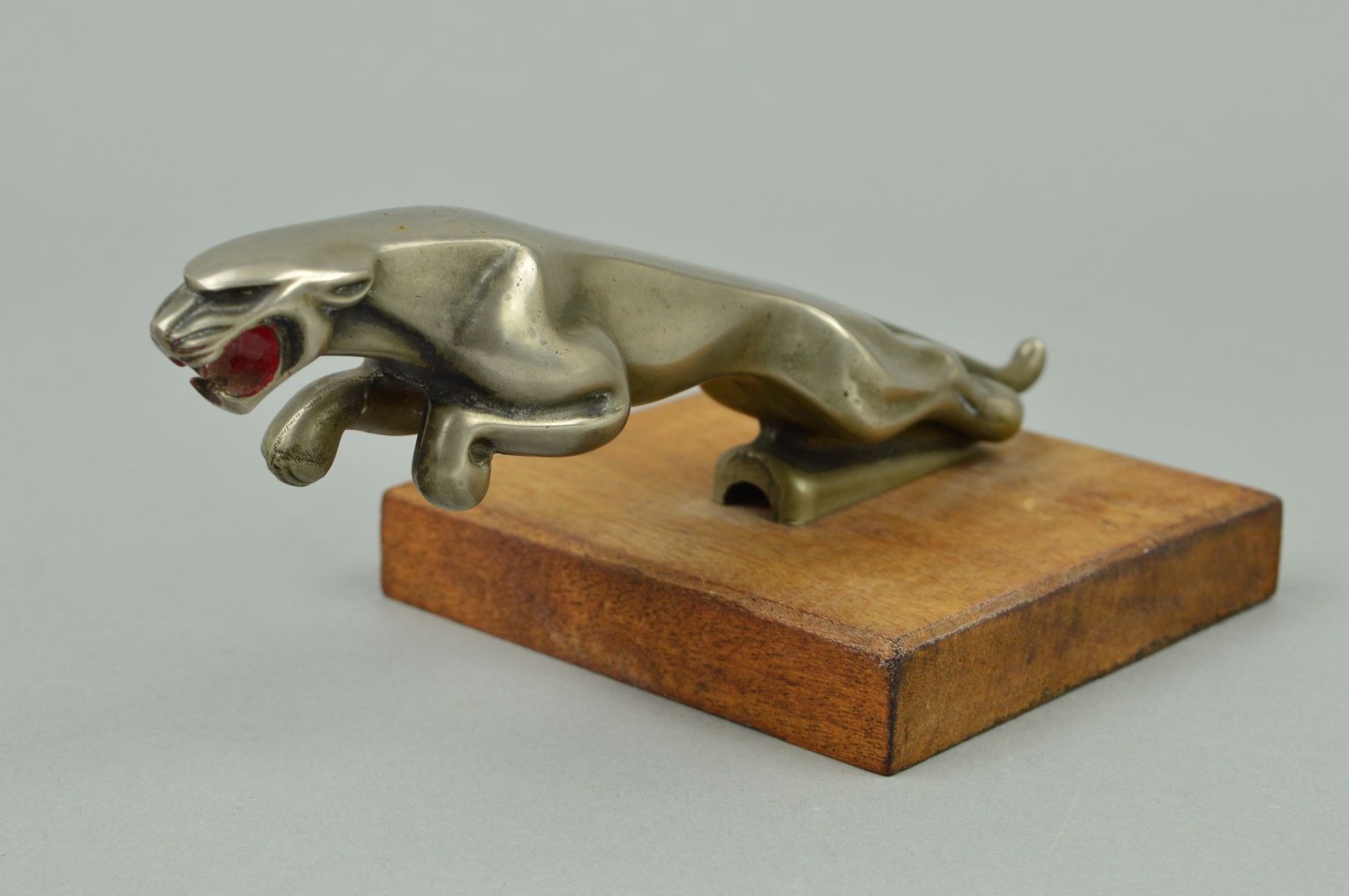 A JAGUAR CAR BONNET MASCOT, chromed leaping Jaguar, code marks to underside 7/10091/1 WBB, length