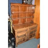 AN OAK DRESSER with two drawers, width 122cm x depth 48cm x height 175cm