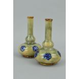 A PAIR OF MINIATURE ROYAL DOULTON STONEWARE BUD VASES, impressed backstamp and No7177, height 9.