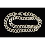 A SILVER CURB LINK NECKLACE designed as large curb links to the spring release clasp, with silver