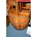 A 20TH CENTURY OAK COOPERED BAR modelled as a barrel (sd)