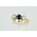 A 9CT GOLD SAPPHIRE AND CUBIC ZIRCONIA THREE STONE RING, ring size O, hallmarked 9ct gold,