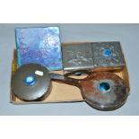 A GROUP OF PEWTER DRESSING TABLE BOXES, silver plated hand mirror and Ruskin tile (5)