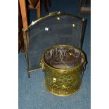 A LATE 19TH CENTURY CIRCULAR BRASS LOG BUCKET, with double lion head handles, diameter 39cm x height
