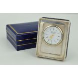 AN ARTHUR PRICE SILVER FRONTED TRAVEL CLOCK of rectangular outline with white circular face and