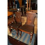 A PAIR OF EDWARDIAN WALNUT HALL CHAIRS and a mahogany wine table (3)
