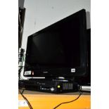 A PANASONIC 32'' LCD FSTV (remote), with a Panasonic DVD player (2)