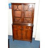 A REPRODUCTION MAHOGANY GLAZED TWO DOOR BOOKCASE (key)