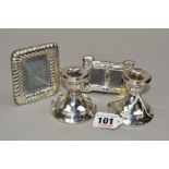 TWO REPRODUCTION ELIZABETH II SILVER MOUN TED PHOTOGRAPH FRAMES, stamped 925, heights 8cm and 5cm,