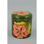 A MOORCROFT POTTERY COVERED POT, 'Hibiscus' pattern on green ground, impressed marks to base and