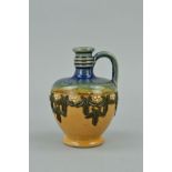 A MINIATURE DOULTON LAMBETH JUG/EWER, impressed backstamp and '521', height 7cm