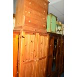A PINE TWO DOOR WARDROBE above two drawers, another pine two wardrobe and a chest of four long