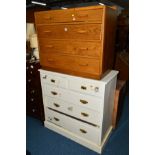 A LOW OAK CHEST OF FOUR LONG GRADUATING DRAWERS, together with a painted Edwardian chest of two