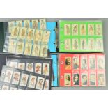 A COLLECTION OF APPROXIMATELY EIGHT HUNDRED AND NINETEEN CIGARETTE CARDS IN SEVENTEEN SETS AND IN