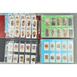 A COLLECTION OF APPROXIMATELY EIGHT HUNDRED AND EIGHTY SIX CIGARETTE CARDS IN EIGHTEEN SETS AND IN
