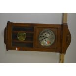 A 20TH CENTURY GOLDEN OAK WALL CLOCK, (winding key)