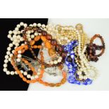 A SELECTION OF COSTUME JEWELLERY NECKLACES to include imitation pearl necklaces, a garnet bead