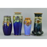 FOUR ROYAL DOULTON STONEWARE VASES, to include a tapered vase, tube lined floral decoration on