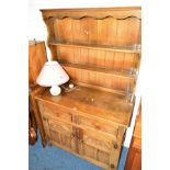 AN OAK DRESSER with two drawers and double cupboard doors, width 103cm x depth 47cm x height 171cm