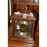 ELLIOTTS OF LONDON ,a mahogany bracket clock with single carrying handle, brass and silvered dial