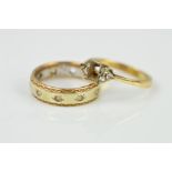 TWO 9CT GOLD RINGS, the first an eternity ring, the central band in a white metal with yellow