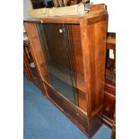 AN OAK BOOKCASE with double glazed sliding doors, width 111.5cm x depth 28cm x height 155cm together