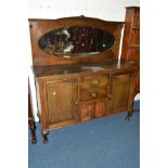 AN EARLY 20TH CENTURY OAK MIRROR BACK SIDEBOARD, the base with single cupboard doors flanking two