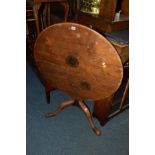 A GEORGIAN MAHOGANY TILT TOP TRIPOD TABLE, together with two elm spindle back chairs and three other