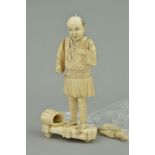 A LATE 19TH CENTURY JAPANESE CARVED IVORY OKIMONO, of a fisherman, height 16cm, same losses, repairs