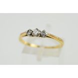 A 14CT GOLD THREE STONE DIAMOND RING designed as three graduated brilliant cut diamonds within