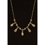 A PERIDOT, AMETHYST AND DIAMOND NECKLACE, designed as five slightly tapered panels with scrolling