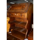 A SLIM OAK BUREAU with a single drawer (key)