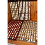 A COLLECTION OF THIMBLES, housed in four display stands