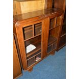 AN ART DECO OAK ASTRAGAL GLAZED TWO DOOR BOOKCASE, width 106cm x depth 32cm x height 116cm