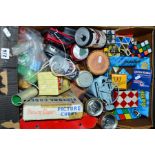 A BOX OF MISCELLANEOUS ITEMS, to include Rubik cubes, novelty cans (Coca-Cola radio alarm, camera