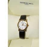 A CASED RAYMOND WEIL LADY'S QUARTZ WRISTWATCH, the oval head with white dial and Roman numeral