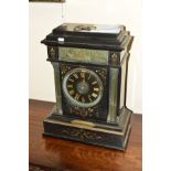 A VICTORIAN BLACK SLATE MANTEL CLOCK OF ARCHITECTURAL FORM, inset metal plaque of classical scene