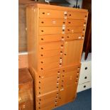 TWO MATCHING MODERN BEECH OFFICE CHESTS of twelve drawers with a single cupboard door, width 85cm