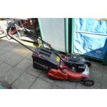 A COBRA RM46SPH SELF PROPELLED REAR ROLLER PETROL LAWN MOWER, fitted with a Honda engine and grass