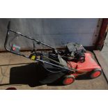 A MOUNTFIELD S38 PETROL LAWN SCARIFIER with collection box