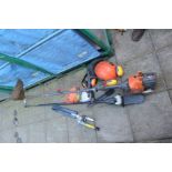 A FLYMO XLT 3000 PETROL GARDEN MULTI TOOL with various attachments including a garden trimmer, extra