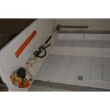 A STIHL KM55R KOMBI ENGINE MULTI PETROL TOOL with 19’’ angled hedge trimmer attachment (pulls but