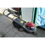 A CHAMPION PREMIER GCV160 PETROL SELF PROPELLED LAWNMOWER with grassbox (tested and working, rusting