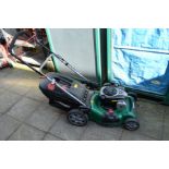 A QUALCAST XSZ46E-SD SELF PROPELLED PETROL LAWNMOWER with 140cc engine, grass box, loose parts and