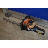 A STIHL HS75 PETROL HEDGE TRIMMER (no blade cover and rusted blade) (pulls but doesn't fire)