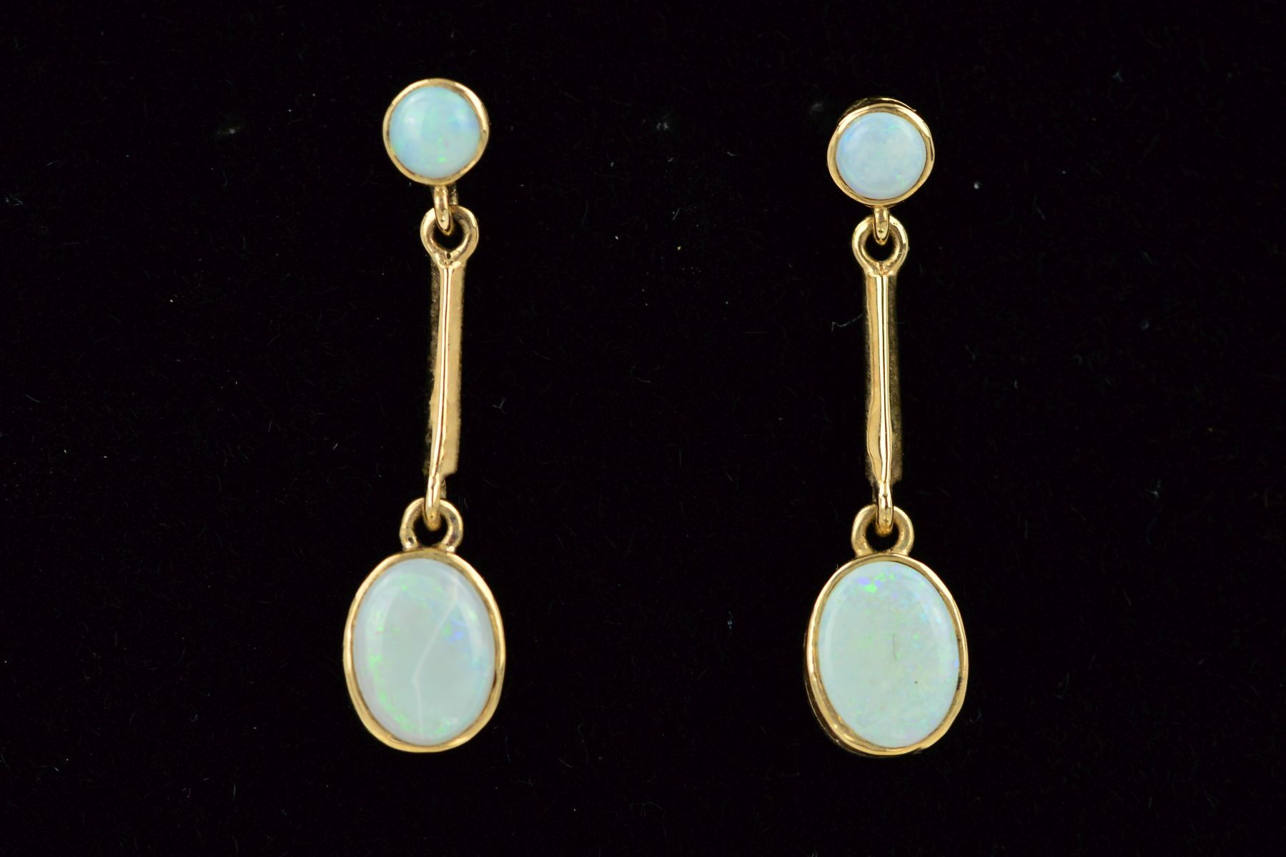 A PAIR OF 9CT GOLD OPAL DROP EARRINGS, each designed as a circular opal within a collet setting